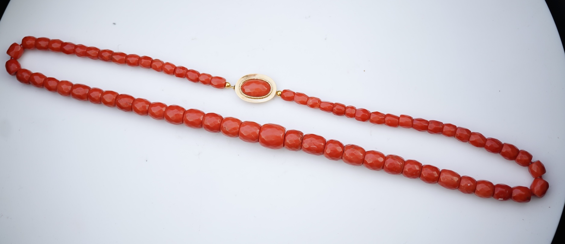 A coral bead necklace, mid 19th century